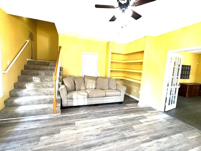 living room featuring hardwood / wood-style flooring and ceiling fan