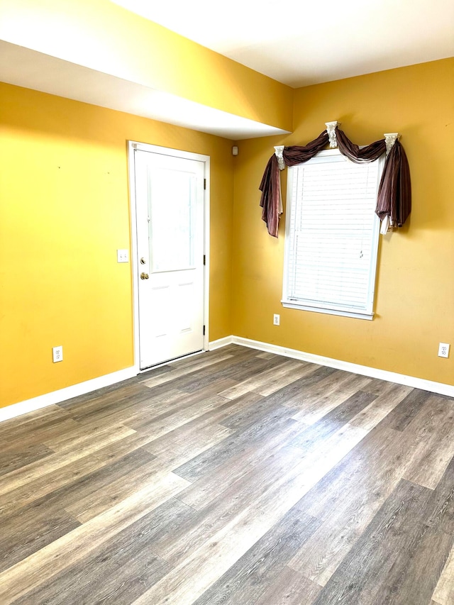 spare room featuring hardwood / wood-style flooring