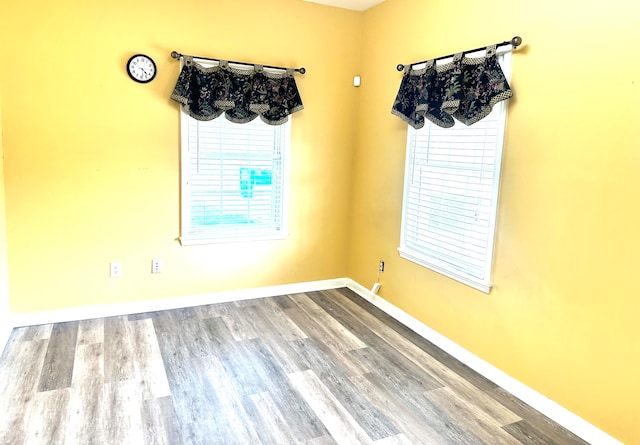 unfurnished room featuring wood-type flooring