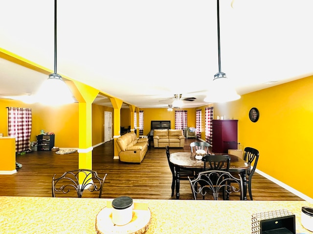 dining room featuring hardwood / wood-style flooring and ceiling fan