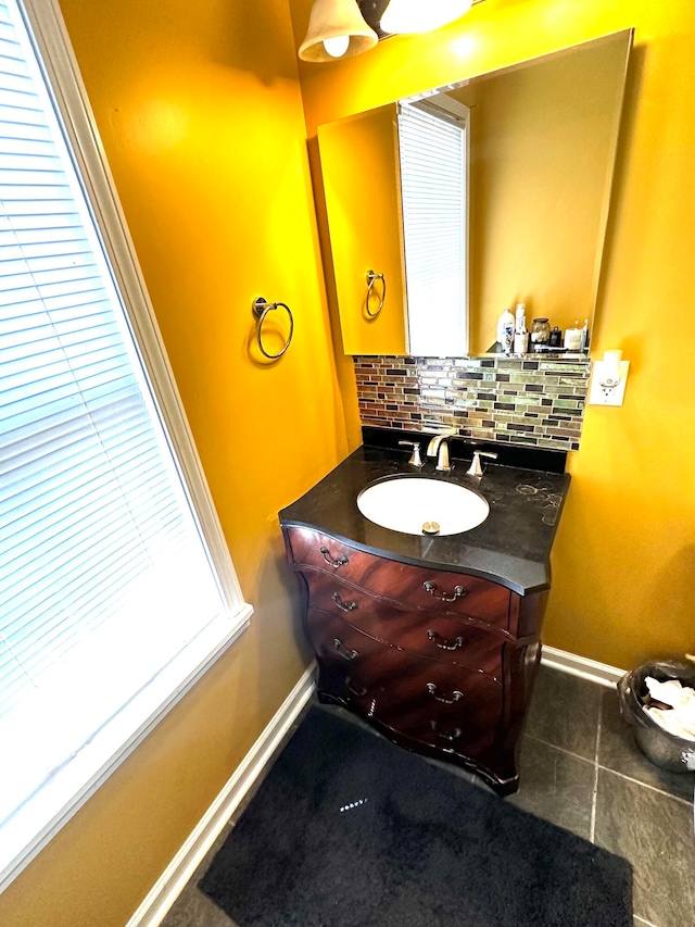 bathroom featuring vanity, decorative backsplash, and tile patterned floors