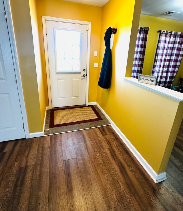 entryway with dark wood-type flooring