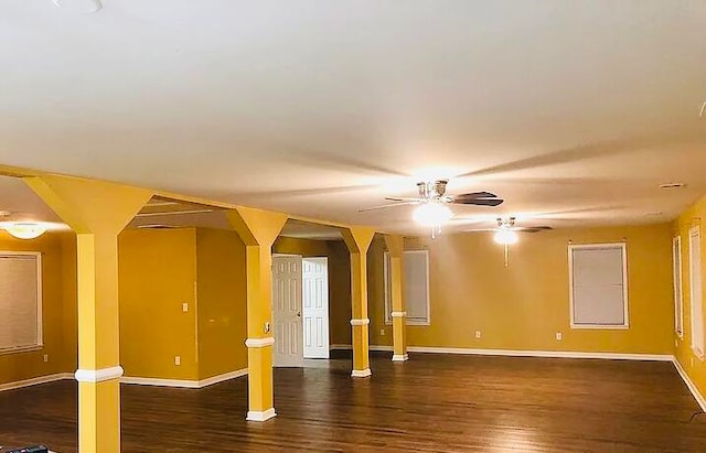 empty room featuring dark hardwood / wood-style floors and ceiling fan