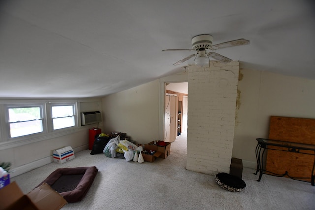bonus room with carpet flooring, ceiling fan, vaulted ceiling, and a wall unit AC