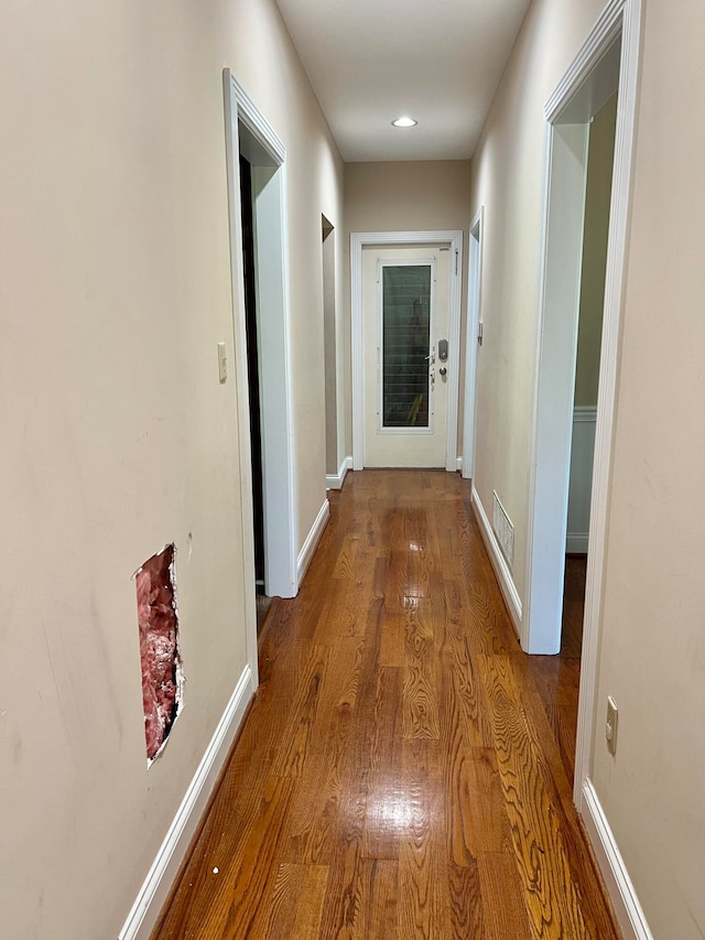 corridor featuring hardwood / wood-style flooring