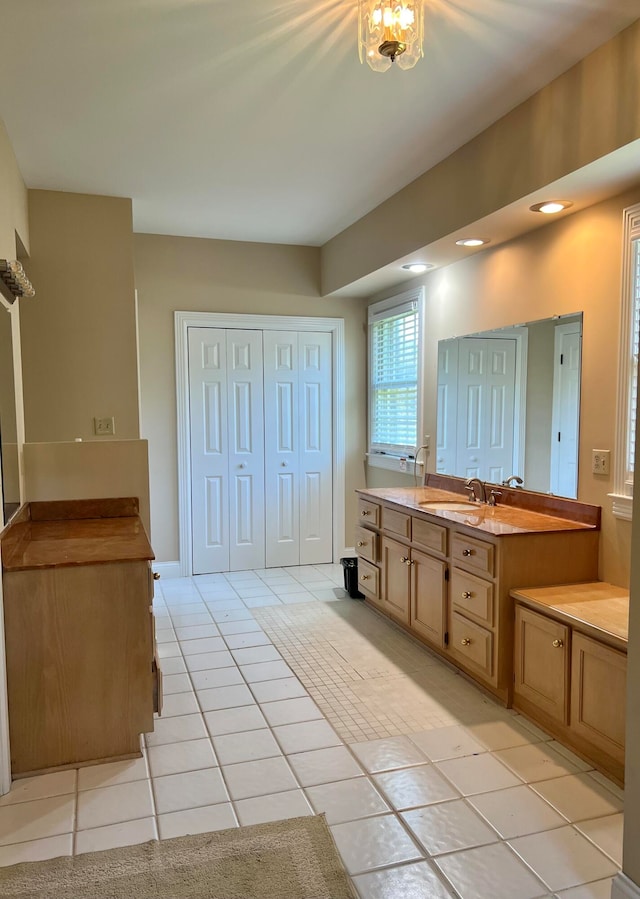 bathroom with vanity and tile patterned flooring