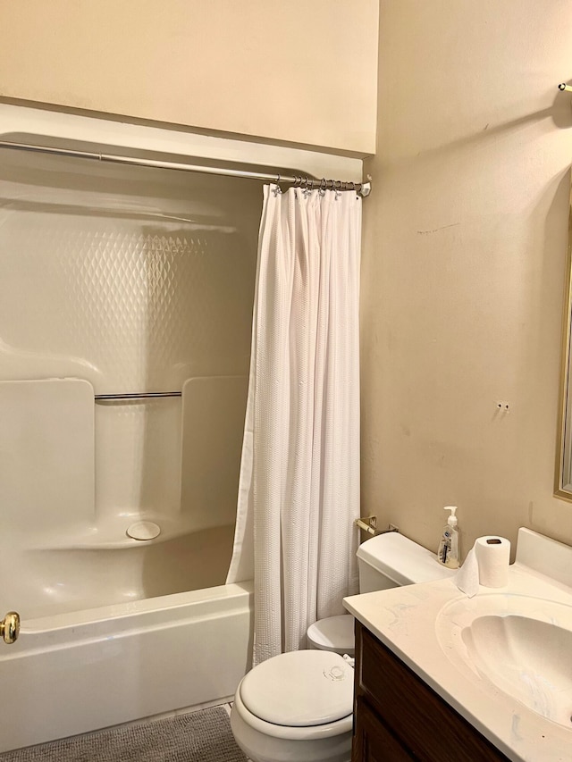 full bathroom with shower / bathtub combination with curtain, vanity, and toilet