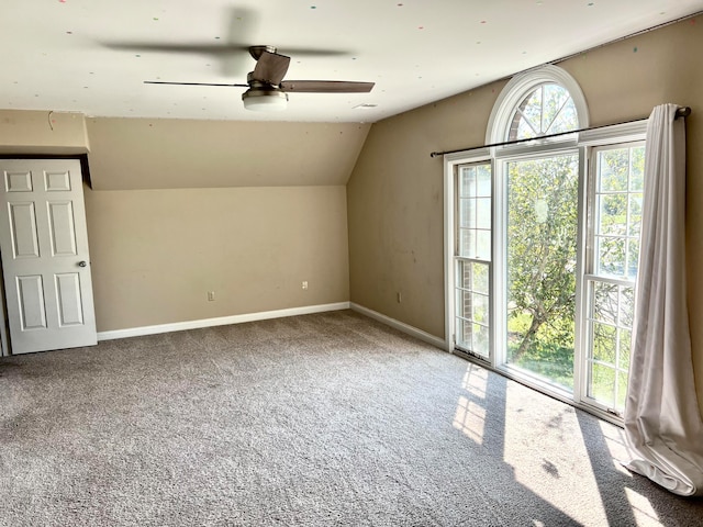 bonus room featuring lofted ceiling, ceiling fan, and carpet flooring