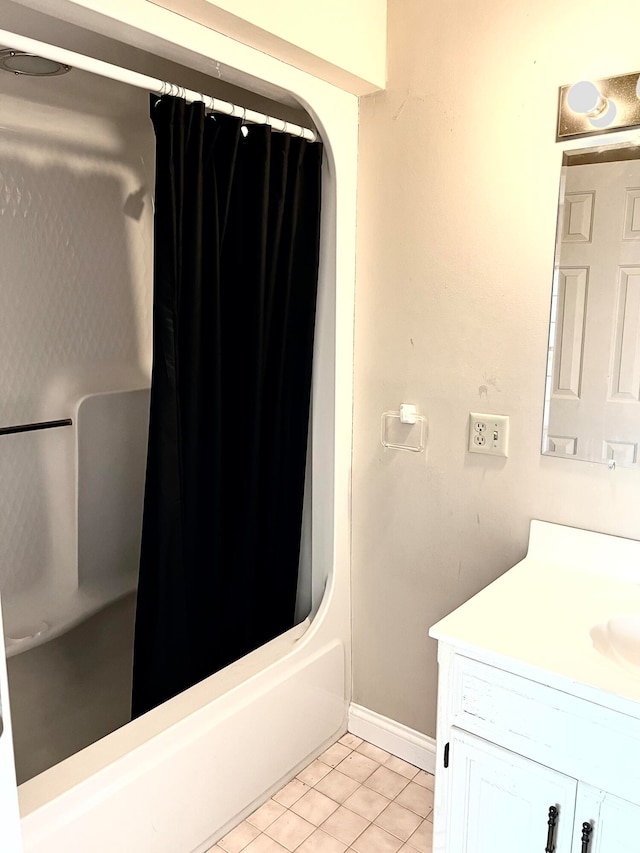 bathroom with tile patterned flooring, vanity, and shower / bath combo with shower curtain