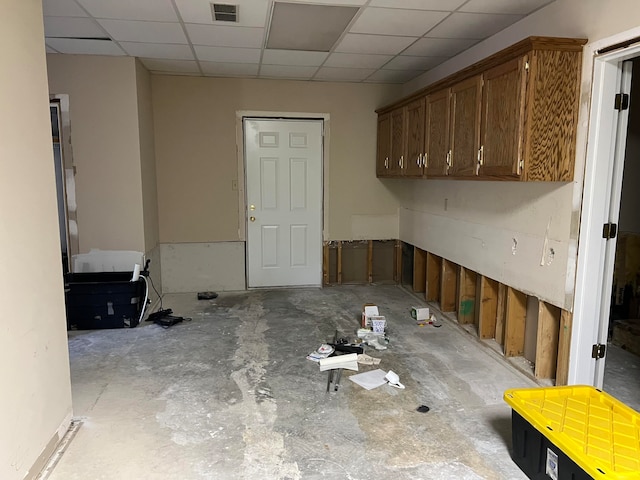 empty room featuring a paneled ceiling