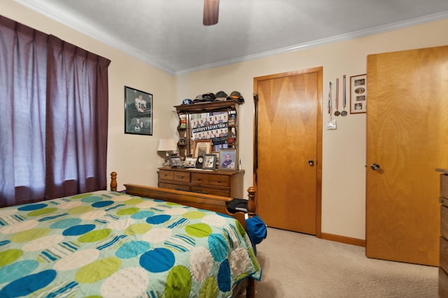 bedroom with ceiling fan, light carpet, and ornamental molding