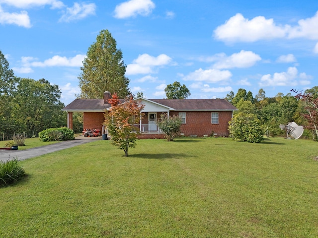 ranch-style home with a front lawn and a porch