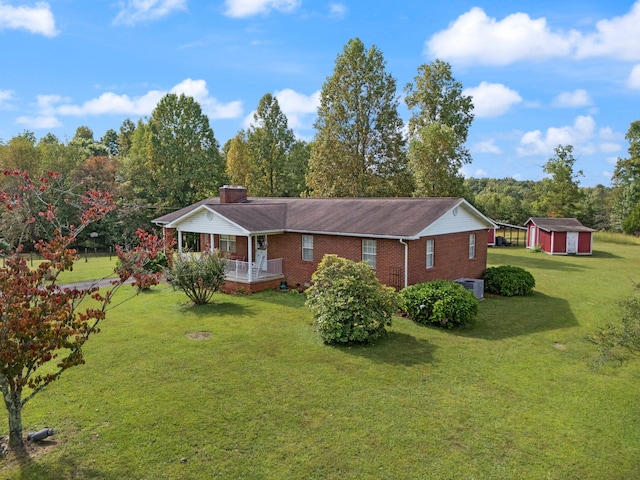 exterior space with a front yard and a storage unit