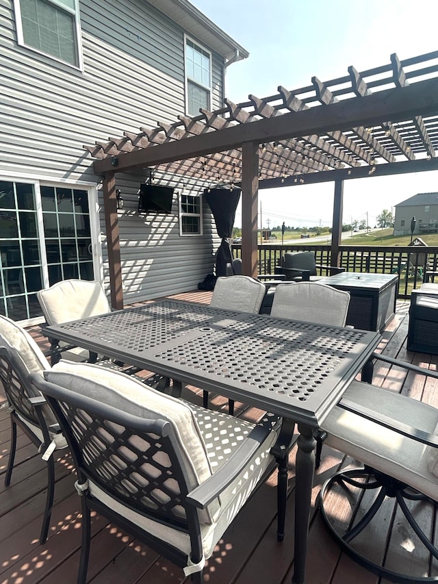 wooden terrace featuring a pergola and an outdoor hangout area