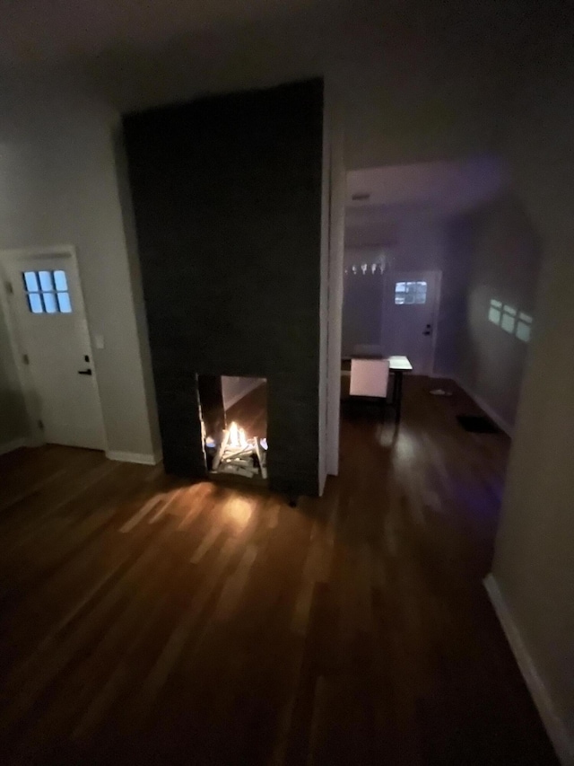 living room featuring wood finished floors and baseboards