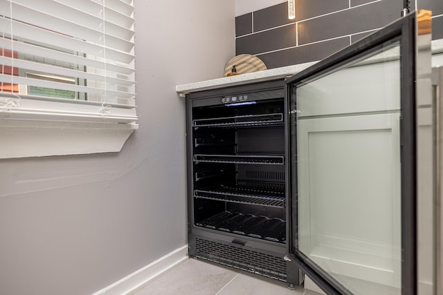 details featuring beverage cooler and baseboards