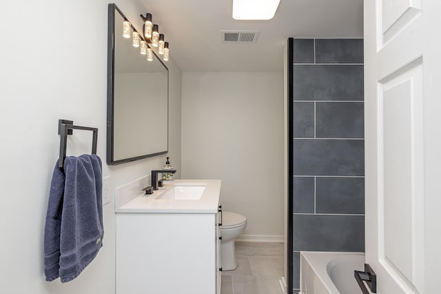 bathroom featuring tile patterned floors, visible vents, toilet, a bathtub, and vanity