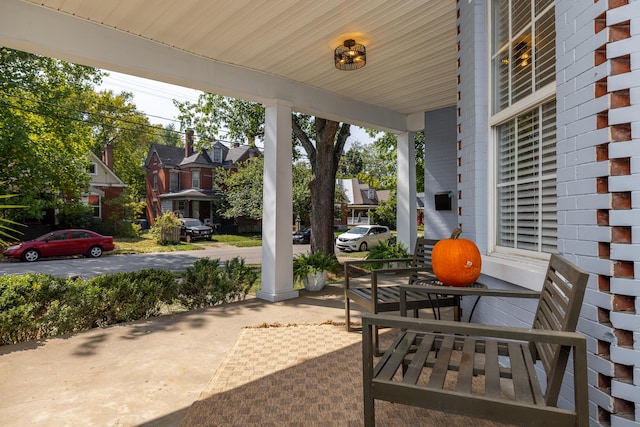 view of patio / terrace featuring a residential view and a porch