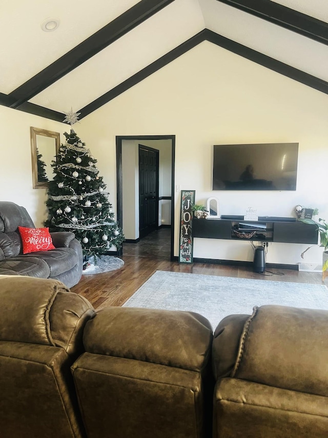 living room featuring beamed ceiling, wood-type flooring, and high vaulted ceiling