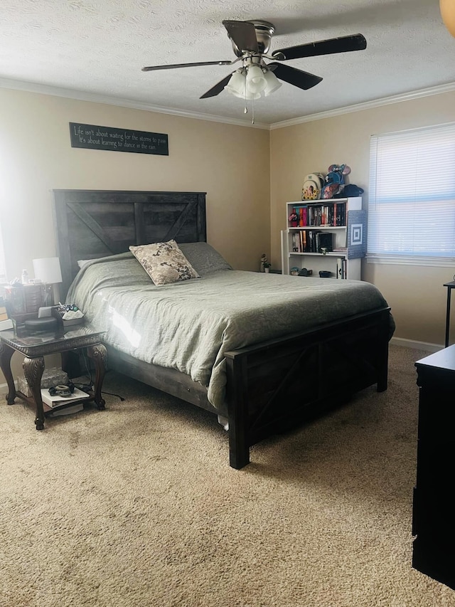 bedroom with carpet flooring, ceiling fan, ornamental molding, and a textured ceiling