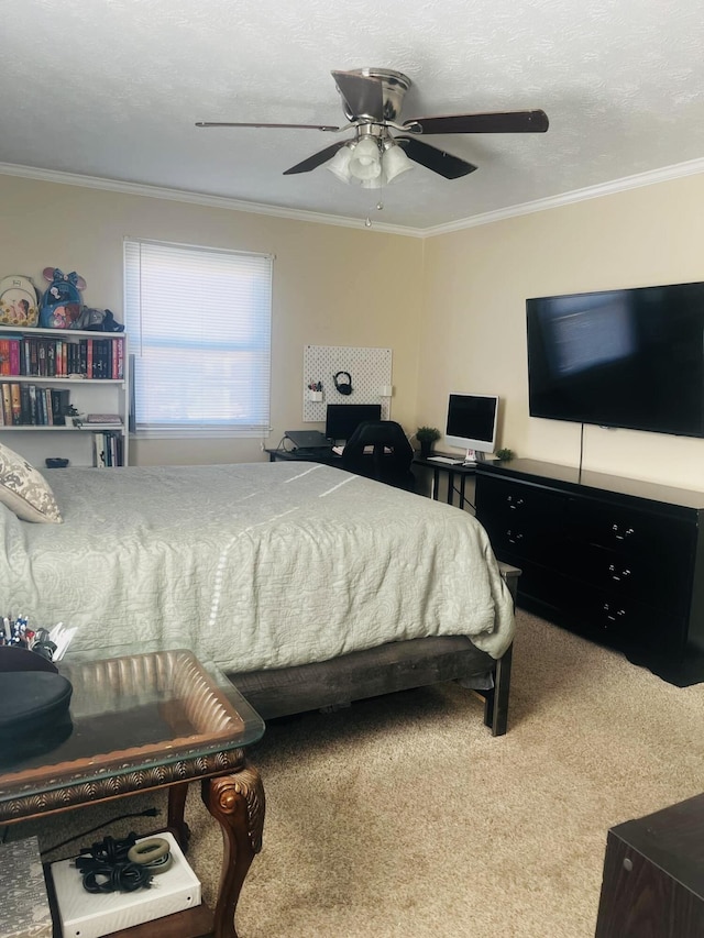 bedroom with carpet flooring, ceiling fan, ornamental molding, and a textured ceiling