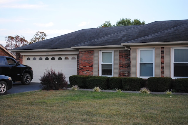 view of front facade with a front lawn and a garage