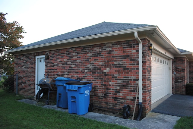 view of side of property with a garage