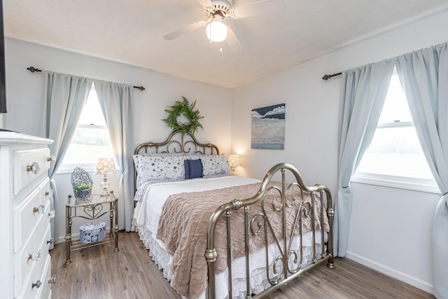 bedroom featuring hardwood / wood-style floors and ceiling fan