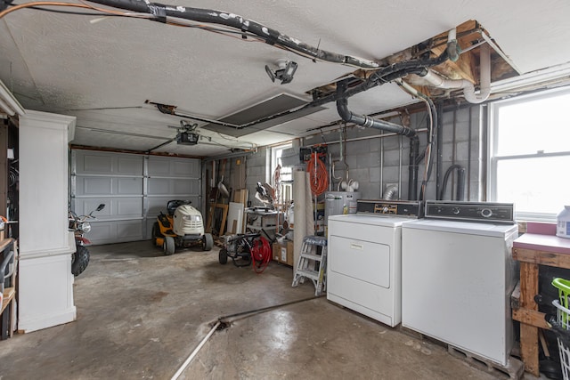 garage featuring a garage door opener and washing machine and clothes dryer