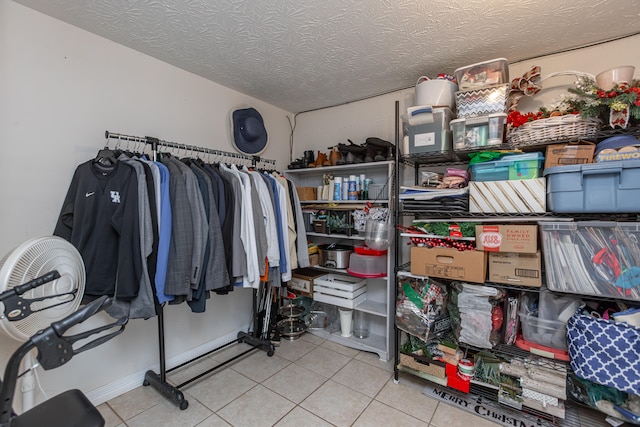 spacious closet featuring light tile patterned floors