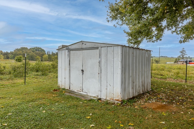 view of outbuilding featuring a lawn