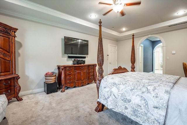 carpeted bedroom featuring crown molding and ceiling fan