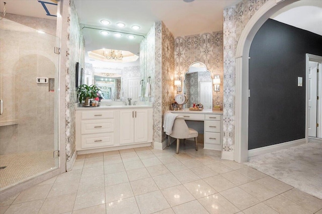 bathroom with tile patterned flooring, vanity, and a shower with shower door