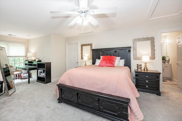 carpeted bedroom featuring ceiling fan and connected bathroom