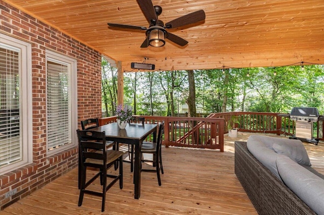 exterior space featuring ceiling fan and area for grilling