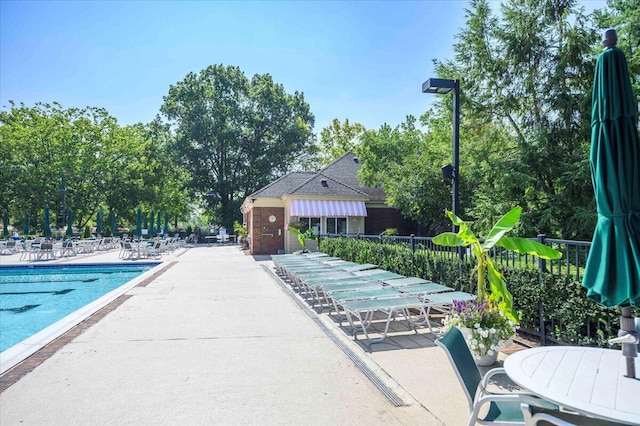 view of swimming pool with a patio area