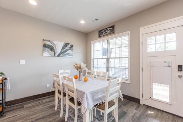 dining area featuring dark wood-type flooring