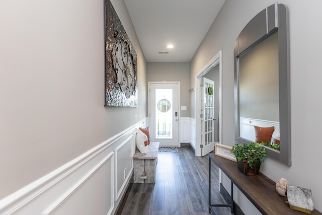 doorway to outside with dark wood-type flooring