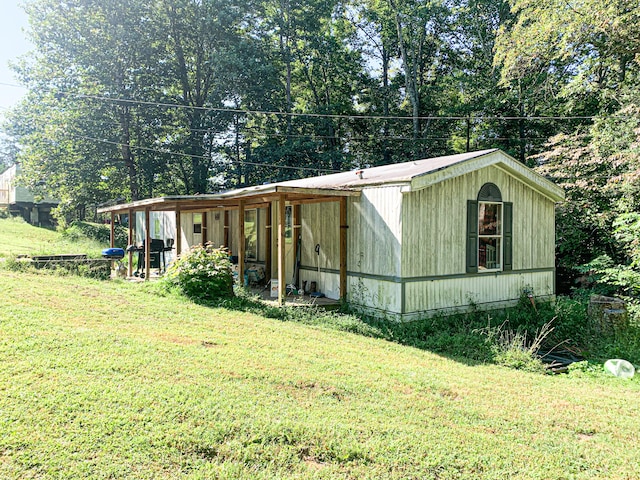 view of property exterior featuring a lawn