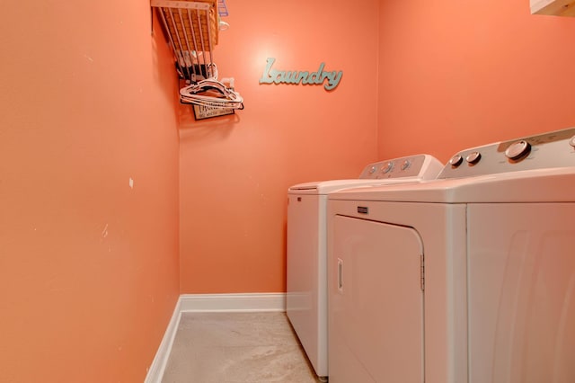 laundry room with washing machine and clothes dryer