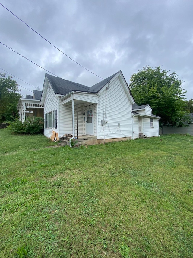 view of property exterior with a yard