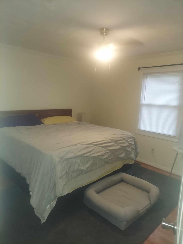 bedroom with hardwood / wood-style flooring