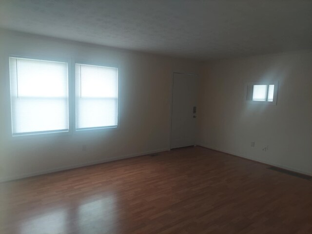 spare room featuring hardwood / wood-style flooring