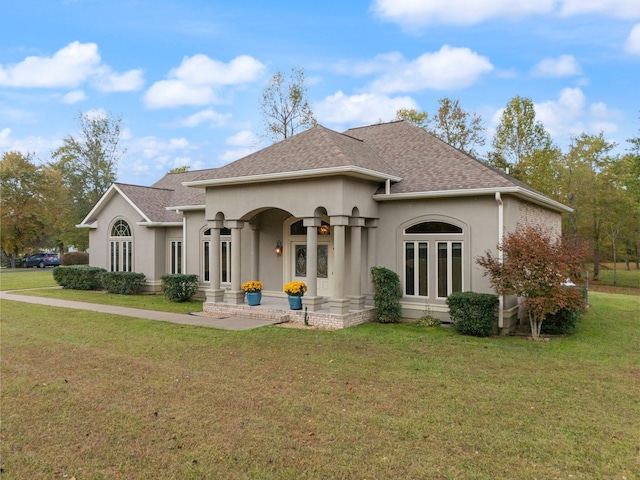 view of front of house featuring a garage and a front yard