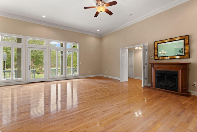 unfurnished living room featuring ornamental molding, light hardwood / wood-style floors, and ceiling fan