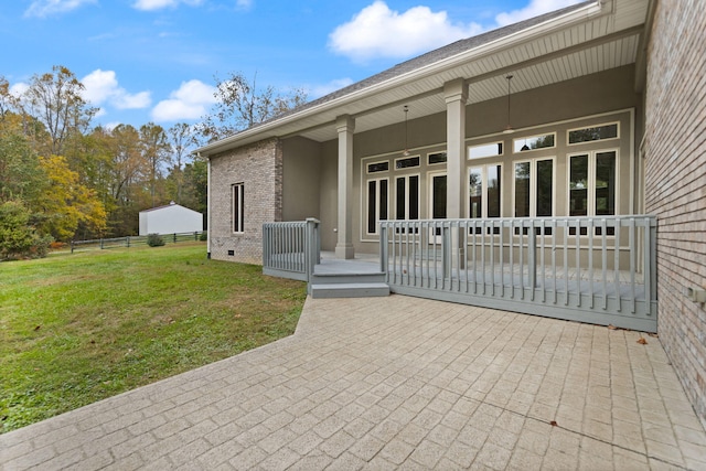 exterior space featuring a yard and a patio area