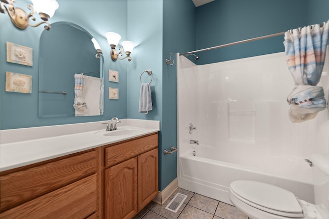 full bathroom with tile patterned flooring, vanity, shower / bath combo with shower curtain, and toilet