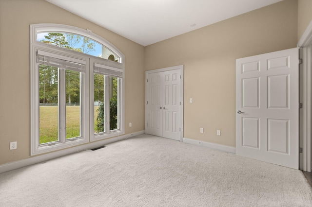 unfurnished bedroom featuring a closet and carpet