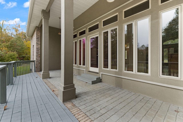 wooden terrace featuring a patio