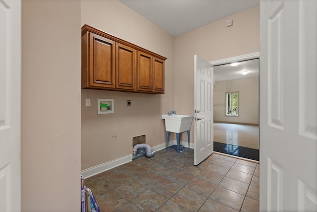 laundry area with cabinets, tile patterned flooring, washer hookup, and hookup for an electric dryer